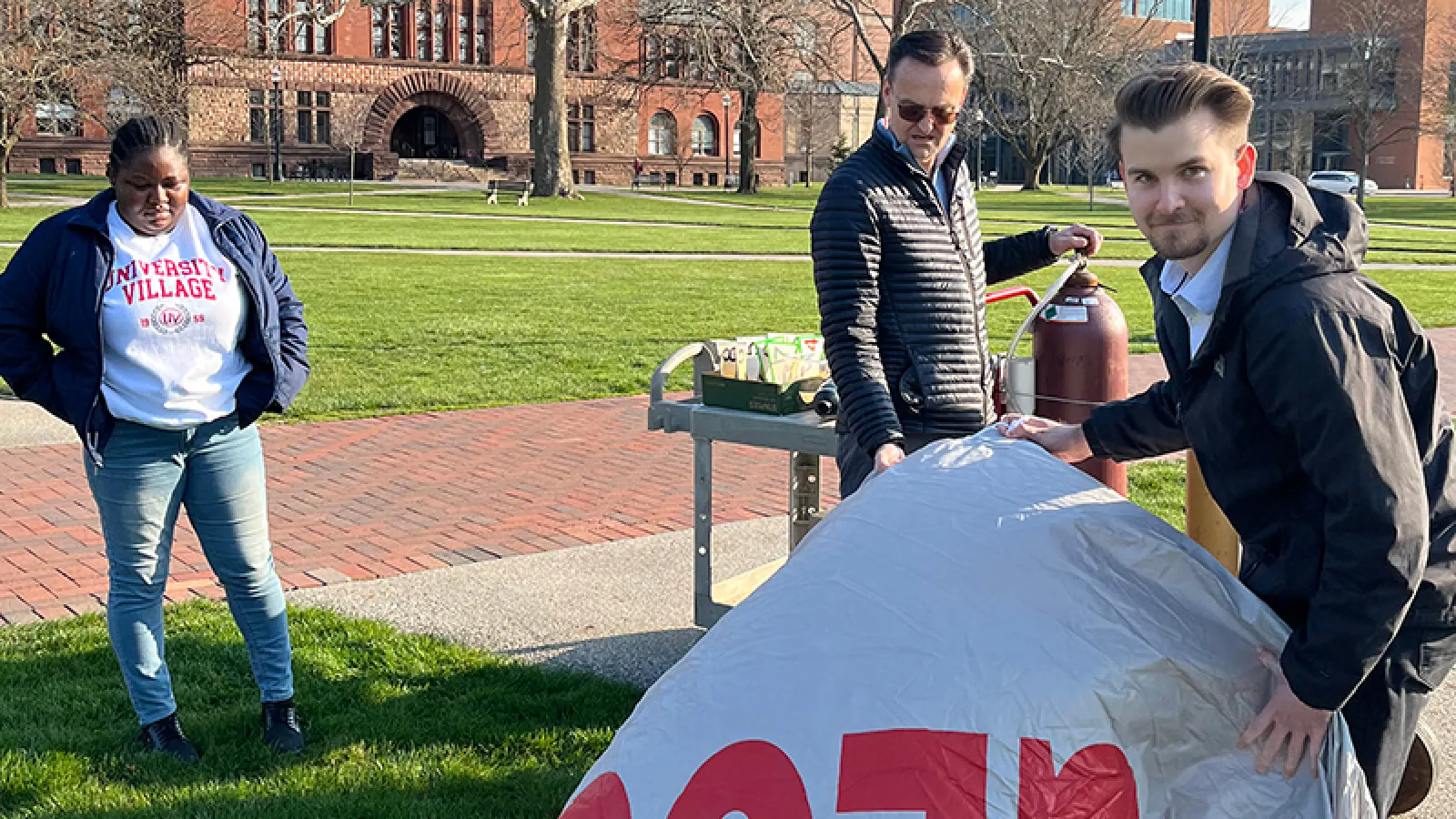 Oluwadamilola Salau, Adam Tjoelker, Jens Blegvad, and Alvaro Montenegro preparing the blimp in the Oval - 3/29/2024