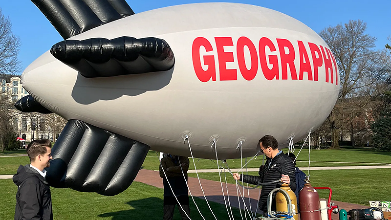 Oluwadamilola Salau, Adam Tjoelker, Jens Blegvad, and Alvaro Montenegro preparing the blimp in the Oval - 3/29/2024