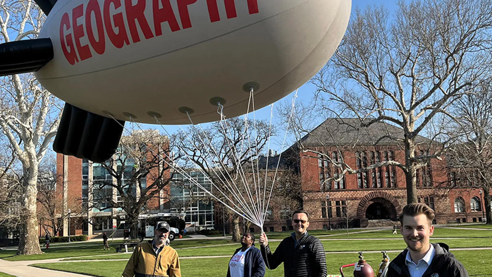 Oluwadamilola Salau, Adam Tjoelker, Jens Blegvad, and Alvaro Montenegro preparing the blimp in the Oval - 3/29/2024