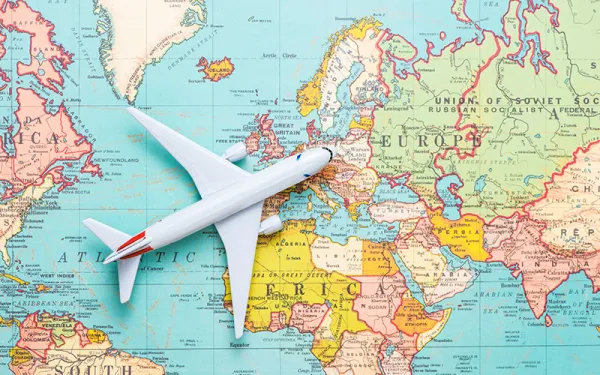 Stock photo - airplane model and map
