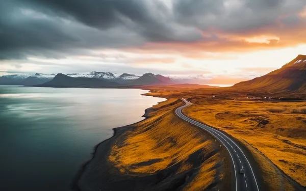 Stock photo - highway along water with mountains