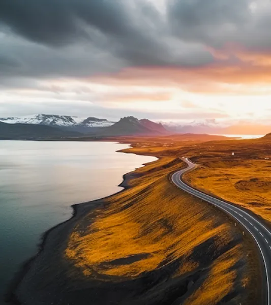 Stock photo - highway along water with mountains